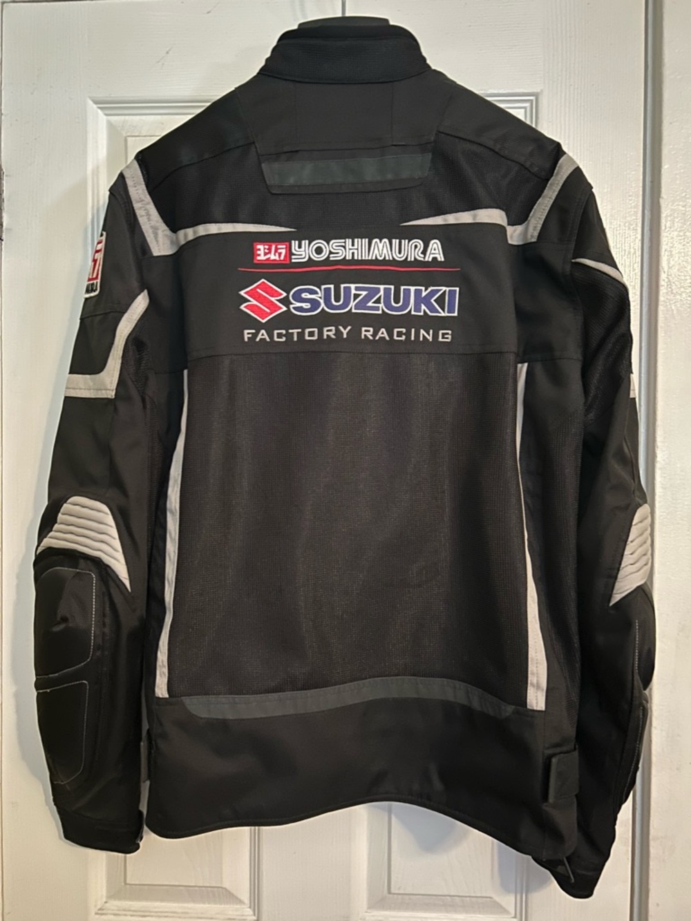 Suzuki Factory Racing Men’s Black Motorcycle Jacket with inner lining.